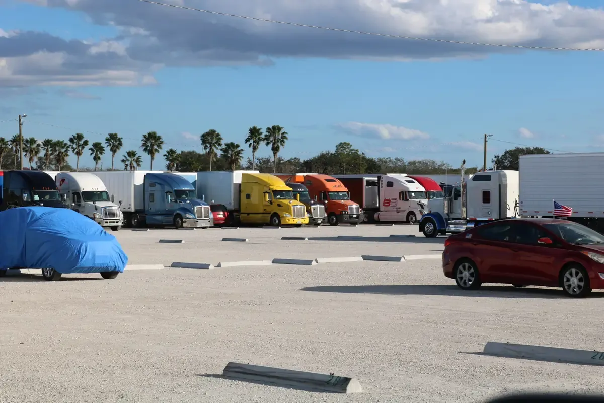 Trucking storage with semi trucks and cars in central Florida