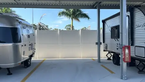 Covered parking bays for cars, trucks, and RVs at a Century Storage facility Punta Gorda