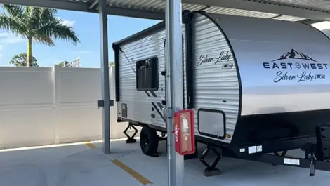 Covered parking bays for cars, trucks, and RVs at Punta Gorda Century Storage.