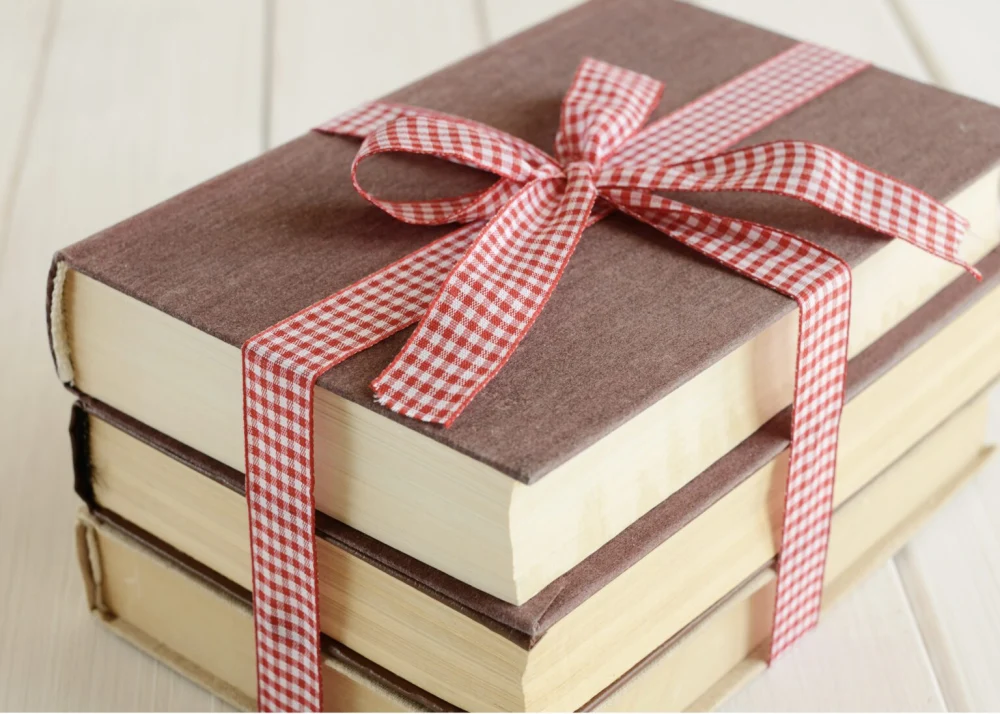 Books wrapped in gift bow